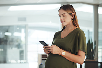 Image showing Phone, networking and pregnant business woman in office on social media, mobile app or internet. Maternity, technology and female designer from Canada with pregnancy scroll on cellphone in workplace.