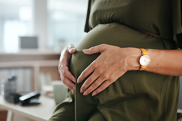 Image showing Worker, office and pregnant with hands, stomach and relax for break, company and workplace. Woman, employee or pregnancy in career, work or job with love, affection or care for baby, closeup or belly