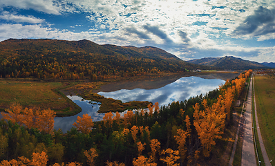 Image showing Aerial view of road in beautiful autumn Altai forest