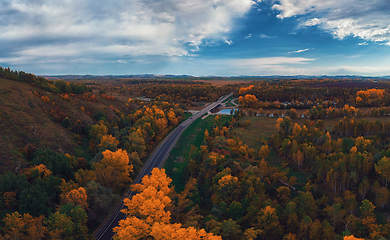 Image showing Aerial view of road in beautiful autumn Altai forest