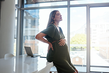 Image showing Pregnant, woman or back pain in office with stress, burnout and relax with eyes closed at desk or table. Person, pregnancy or hand on stomach for risk, anxiety or tired at professional company or job