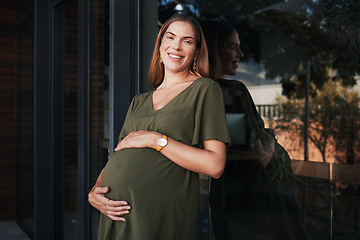 Image showing Portrait, smile and a business pregnant woman on the balcony at her office, excited about maternity leave from work. Company, stomach and pregnancy with a happy young employee at the workplace
