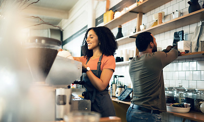 Image showing Happy woman, barista and coffee at cafe for service, beverage or preparation by counter at store. Female person, team or waiter making espresso, cappuccino or latte at restaurant or retail shop