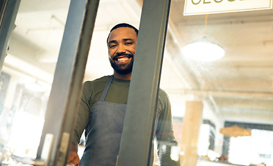 Image showing Happy, door and portrait of a man at a coffee shop to open a small business or welcome customer. Smile, work and a waiter or barista at the entrance of a cafe, restaurant or cafeteria for service