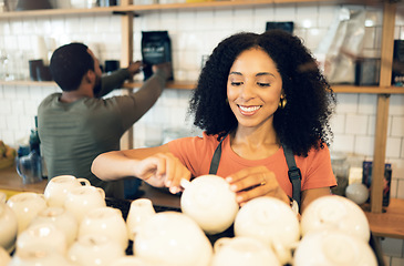 Image showing Barista woman, coffee shop and cleaning cup with smile, packing and organized at small business, startup or store. Waitress woman, man and happy in restaurant, cafe and shelf with work partnership