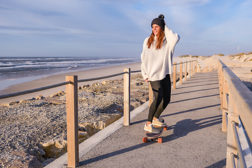 Image showing Girl riding a skateboard 
