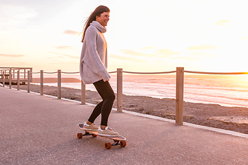 Image showing Girl riding a skateboard 