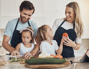 Image showing Happy family, together and bond in kitchen by cooking with preparation, vegan diet and dinner. Children, parents and helping with meal, quality time and nutrition with smile learning and teaching