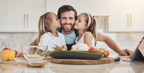 Image showing Portrait, family and kiss on the cheek from kids with their father in the kitchen of a home for cooking together. Face, smile and girl children with their happy parent in the house to make a meal