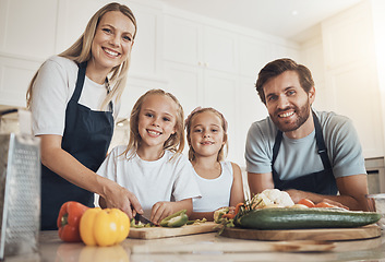 Image showing Family portrait, smile and cooking in kitchen with vegetables for lunch, diet and nutrition. Happy parents and children, food and ingredients for meal prep, healthy and teaching the kids at home