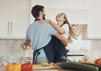 Image showing Cooking, dancing or happy couple in celebration with food for a healthy vegan diet together at home. Hug, vegetables or excited woman bonding in kitchen for dinner with love, smile or romantic man