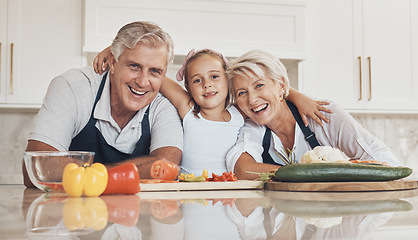 Image showing Family, portrait and girl cooking with grandparents in a kitchen with love, hug or support at home. Food, face and child learning nutrition, health or preparing meal while embracing happy old people