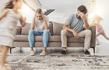 Image showing Frustrated parents, sofa and headache with children running in living room chaos, ADHD or crazy home. Mother and father in stress, burnout or fatigue with busy or hyper active kids in lounge at house