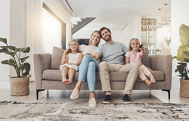 Image showing Home, tv and family with girls on a couch, relax and happiness with weekend break, calm and support. Children, mother and father with kids, resting and smile with care, peace and cheerful in a lounge