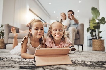 Image showing Children, tablet and relax on carpet for home learning, watch video and happy games with parents in living room. Girl or sister on digital technology for virtual school, family movie or film on floor