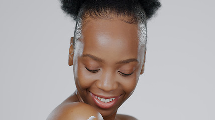 Image showing Woman, face and body for cream or moisturizer, cosmetic and beauty with smile in studio. African model, glow and dermatology with lotion for skincare aesthetic and skin health with grey background