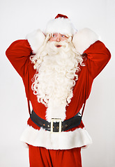 Image showing Santa claus, hand and head for mistake forgot for holidays, Christmas celebration or shock. Male person, costume suit and hand gesture for problem stress, present gifts on white studio background