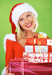 Image showing Woman, Christmas and gift box smile in studio for celebration, happiness or festive season giving. Female person, red outfit and portrait or presents for holiday, winter break or vacation surprise