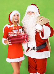 Image showing Santa claus, helper or Christmas gift box on studio green background for festive season, holiday or present giving. Woman, old man or red costume for greeting offer, smile or happy celebration