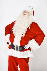 Image showing Santa claus, laugh and in studio for Christmas holiday, festive season or celebration joy. Male person, red outfit and funny on white background mockup for greetings fun, vacation or winter break