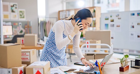 Image showing Ecommerce, Asian woman with phone call and tech, typing and checking sales and work at fashion startup. Online shopping, boxes and small business owner with tablet, laptop and networking for orders.