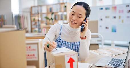 Image showing Ecommerce, woman with phone call and boxes, writing and checking sales and work at Japanese fashion startup. Online shopping, package and small business owner with smartphone, orders and networking.