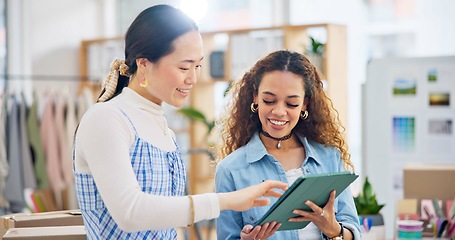 Image showing Woman, fashion designer and tablet in meeting, planning or logistics in small business together at office. Creative female person or employees working on technology for clothing design or startup