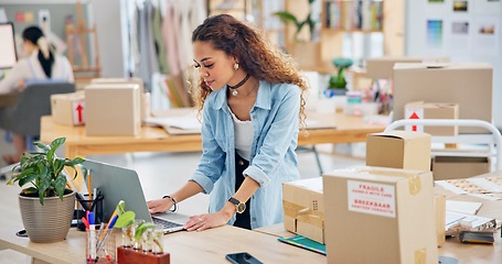 Image showing Woman, boxes and laptop for logistics, e commerce and stock management, online shop and stock management. Startup, small business owner or designer with package inventory, computer and website order