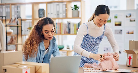 Image showing Small business, laptop and a team packing an order or logistics for fashion delivery in store. Young entrepreneur people or startup company partner for e commerce, parcel or packaging of product