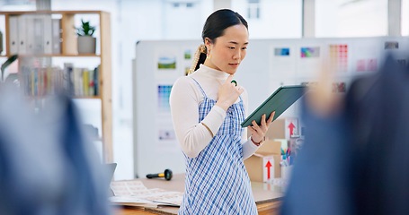 Image showing Tablet, startup and young woman with business checking company website online on internet. Digital technology, retail and Asian female owner scroll for delivery information in store, shop or boutique