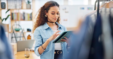 Image showing Fashion, employee and woman with a tablet, store and inventory with ecommerce, connection and typing. Person, shop assistant and worker with technology, small business and online shopping with retail