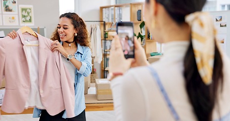 Image showing Fashion influencer, cellphone and women live streaming clothes presentation, style review or mobile app broadcast. Phone, content creator team and small business owner teamwork on retail commercial