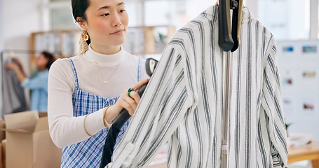 Image showing Asian woman, fashion designer and steam clothing in logistics, small business or quality service at boutique. Female person in dry cleaning, retail store or product preparation for delivery at shop