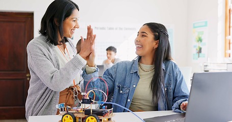 Image showing Learning, teacher and high five of student on laptop in classroom, achievement or goal in robotics. Engineering, computer and teenager celebrate success, happy girl and study education at high school