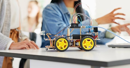 Image showing Hands, robotics classroom and students at school, learning or discussion for future development. Group, people and education with electronics, transportation or energy for moving, building or talking