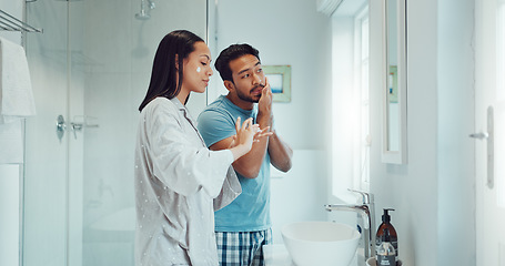 Image showing Couple, bathroom and cleaning face with cream, skincare and comic joke with laughing, serum or product. Man, woman and funny with facial oil moisturizer for beauty, wellness or self care in apartment