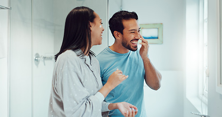 Image showing Couple, bathroom and cleaning face with cream, skincare and comic joke with laughing, serum or product. Man, woman and funny with facial oil moisturizer for beauty, wellness or self care in apartment