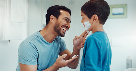Image showing Father, child and learning with shaving cream or teaching a boy a skincare, morning beauty routine and grooming in the bathroom. Shave together, son and dad helping with foam, razor and skin care