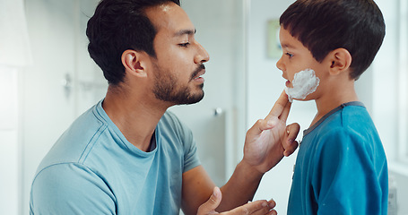 Image showing Father, child and learning with shaving cream or teaching a boy a skincare, morning beauty routine and grooming in the bathroom. Shave together, son and dad helping with foam, razor and skin care