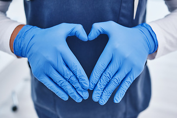 Image showing Heart emoji, hospital and hands of doctor for medicine, surgery and working in clinic for wellness. Healthcare ppe, help and person with hand sign for insurance, support or cardiology medical service