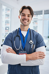 Image showing Medical portrait, arms crossed and happy man, doctor or surgeon with confidence, nurse pride and ready for wellness service. Healthcare trust, happiness and nursing medic for cardiology support help