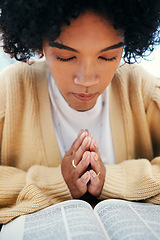 Image showing Woman, bible and praying in Church, worship and Christian religion, reading or studying. Person, holy book and meditation for God, Jesus Christ and faith in spiritual gospel, praise or hope for help