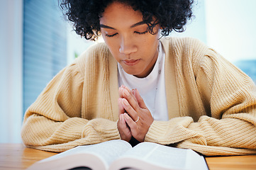 Image showing Bible, prayer and woman in home for religion, Christian worship and reading to study. Person, holy book and meditation at desk for God, Jesus Christ and faith in spiritual gospel, praise and hope