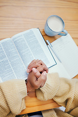 Image showing Bible, notes and hands of woman in prayer at desk in home, Christian faith or knowledge of God from above. Reading, study and girl at table with holy book, learning gospel for inspiration or theology