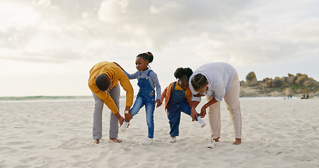 Image showing Summer, sand and a black family at the beach with shoes for walking or running together. Happy, travel and African children with parents getting ready for playing by the sea during a holiday