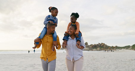 Image showing Family, kids on parents shoulders at beach and travel, playful and freedom outdoor with love and bonding. Carefree, energy and holiday, people walk in nature, mom and dad with children and happiness