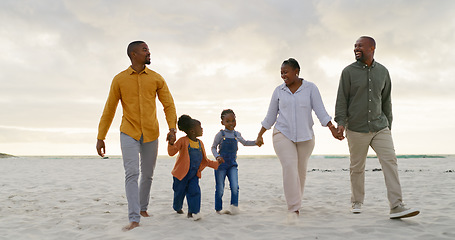 Image showing Love, travel and holding hands with black family at beach for summer, vacation and relax. Holiday, support and happy with parents and children walking on coastline for care, trust and freedom