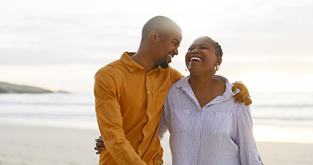 Image showing African couple, beach and arm for walk with love in outdoor for quality time on vacation. Happiness, man and women with bonding with ocean for travel or holiday to relax are cheerful together.