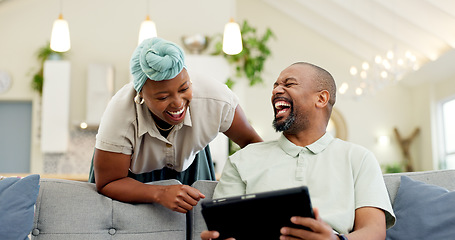 Image showing Black couple, laughing and tablet on a home sofa for streaming, meme and internet in a living room. African woman and man together to talk about tech, funny post or video on social media or network