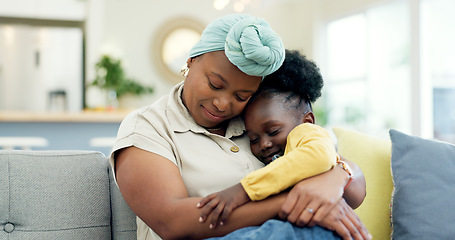 Image showing Mother hug sleeping child on couch for love, care or holding for comfort in lounge at home. Black woman, happy mom and kissing girl kid on lap for nap, rest or support to relax on sofa in living room